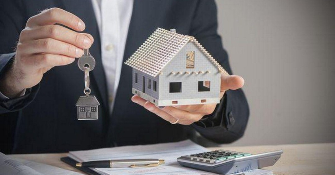 Real Estate Agent Hand Over Property Or New Home Keys To A Customer