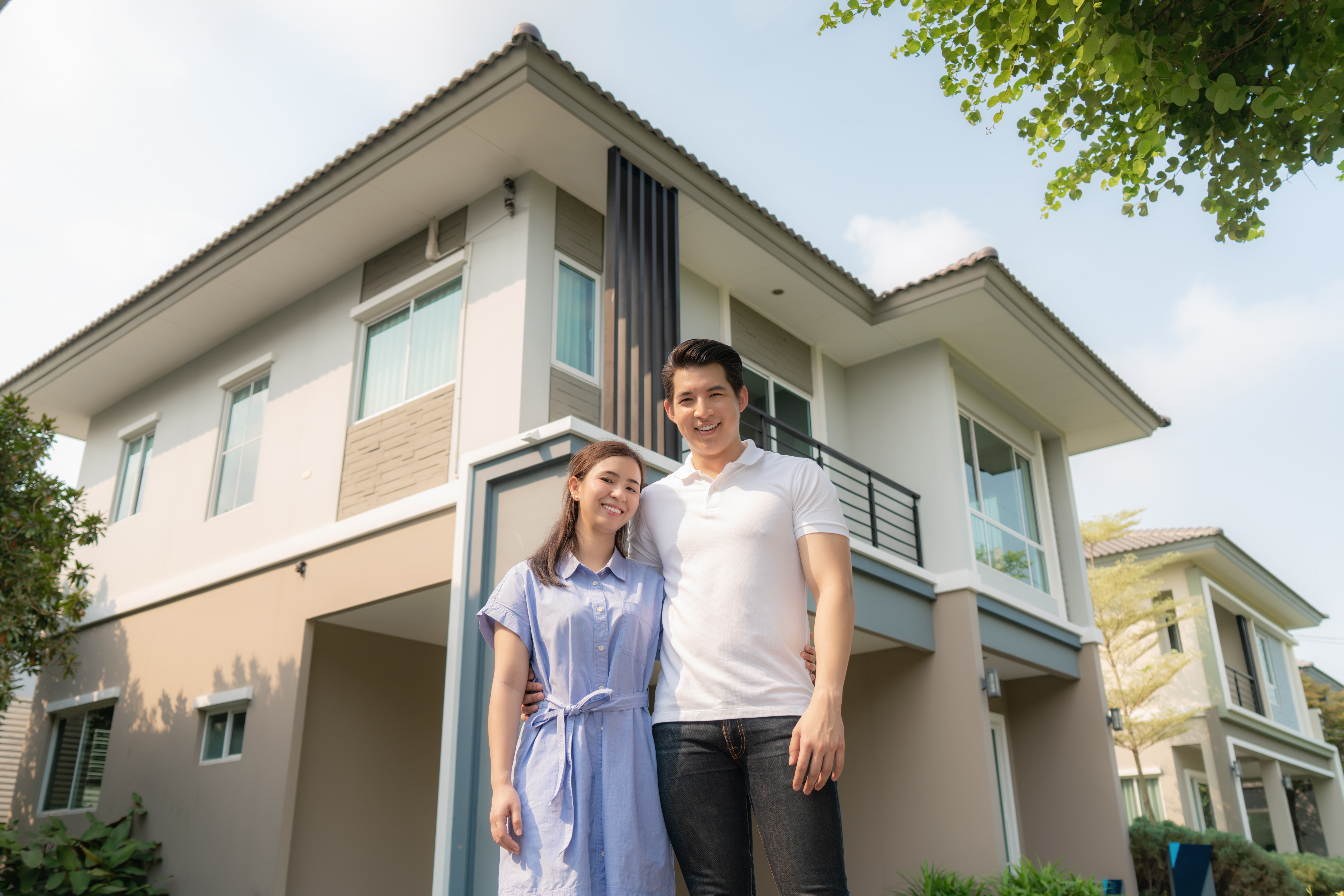 Portrait Of Asian Young Couple Standing And Hugging Together Loo